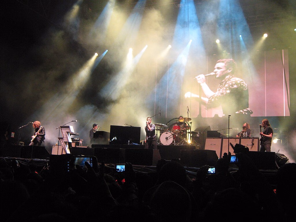 A lit concert stage in front of a crowd in Bogotá