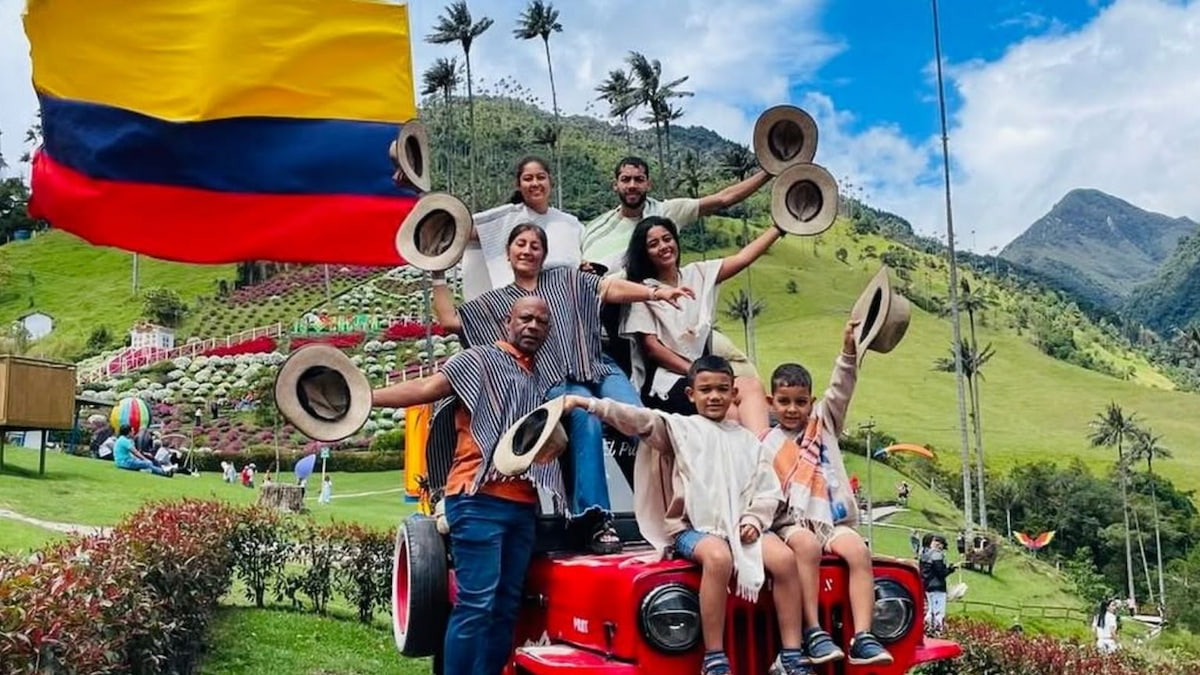 Family posing on a Willys jeep near Cocora Valley, Salento, Colombia