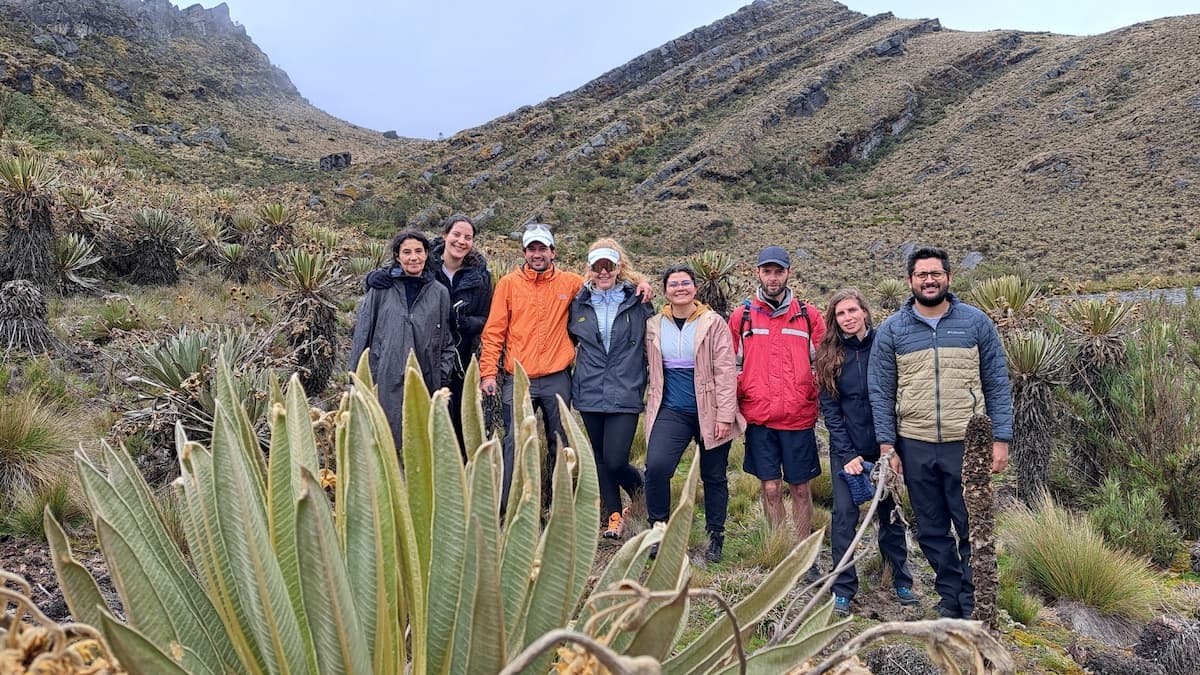Hiking group posing among frailejones in Sumapaz Páramo, Colombia
