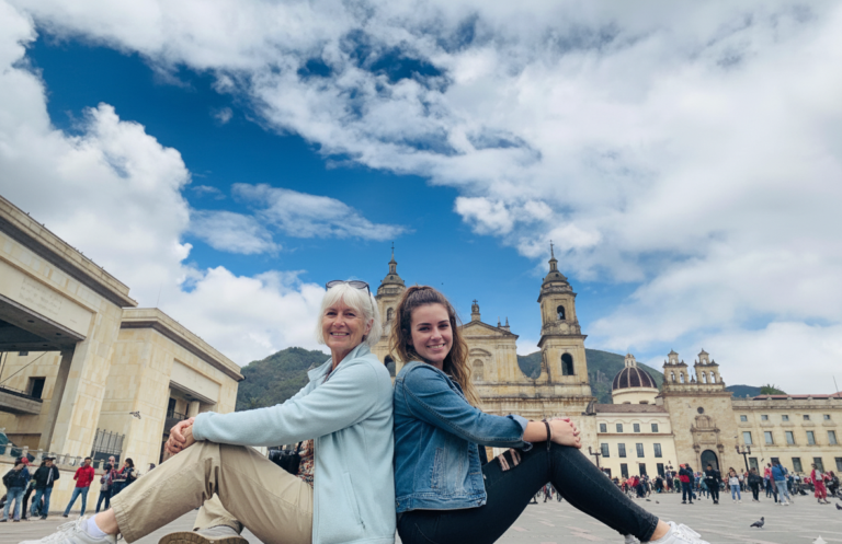 Travelers in Plaza de Bolívar with the cathedral behind, Bogotá