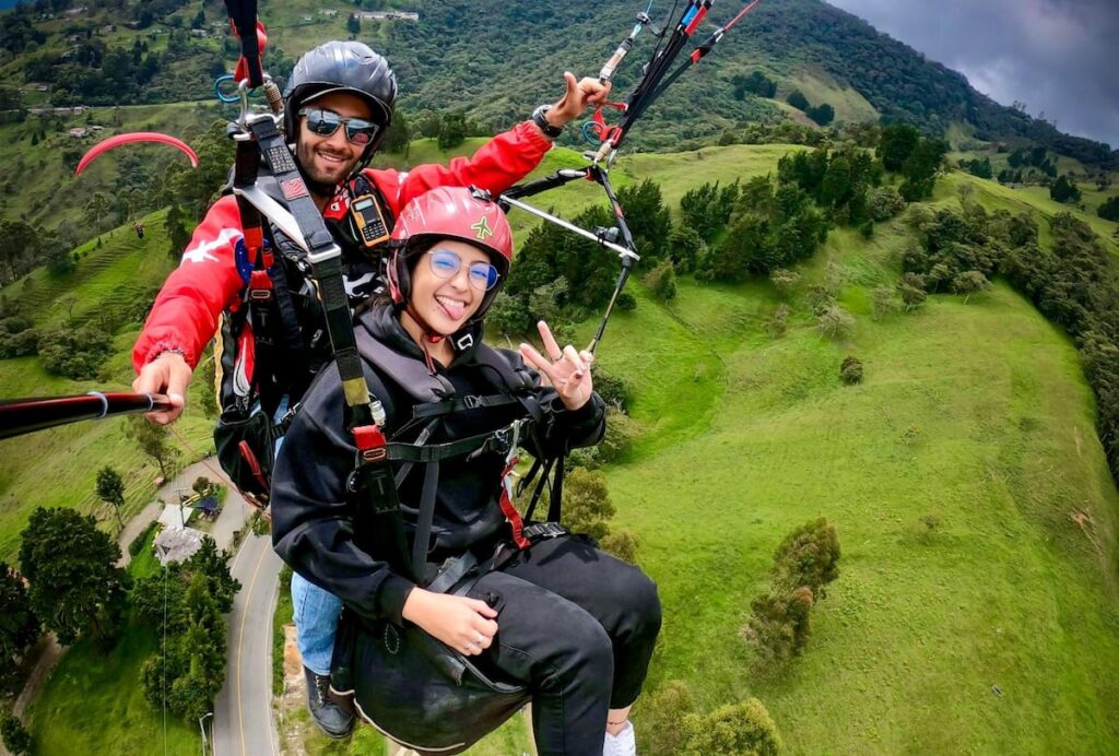 paragliding flight over green andean ridges near Medellín colombia