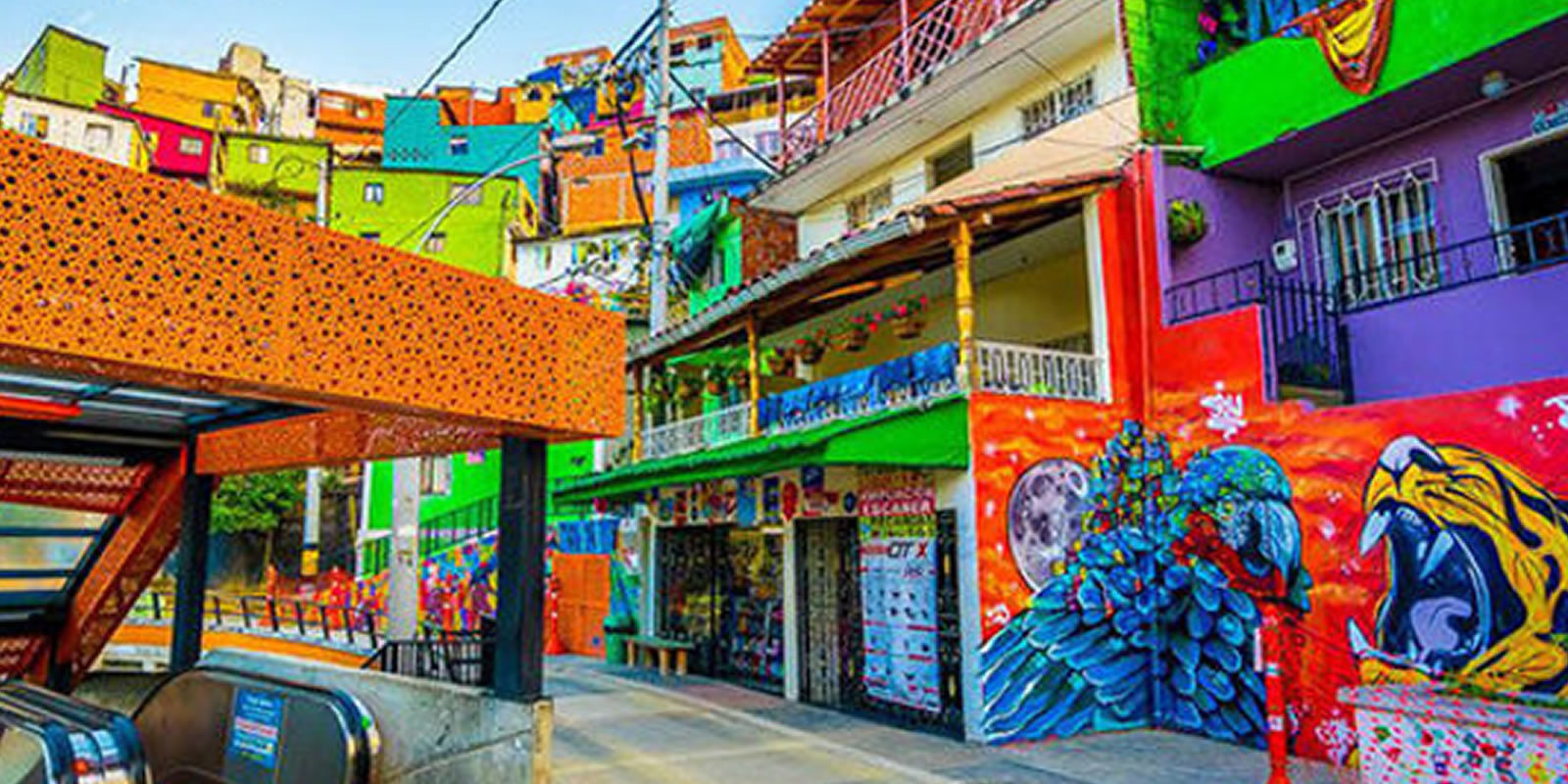Outdoor escalators and colorful murals on a Graffiti Tour Medellin in Comuna 13, Medellin, Colombia