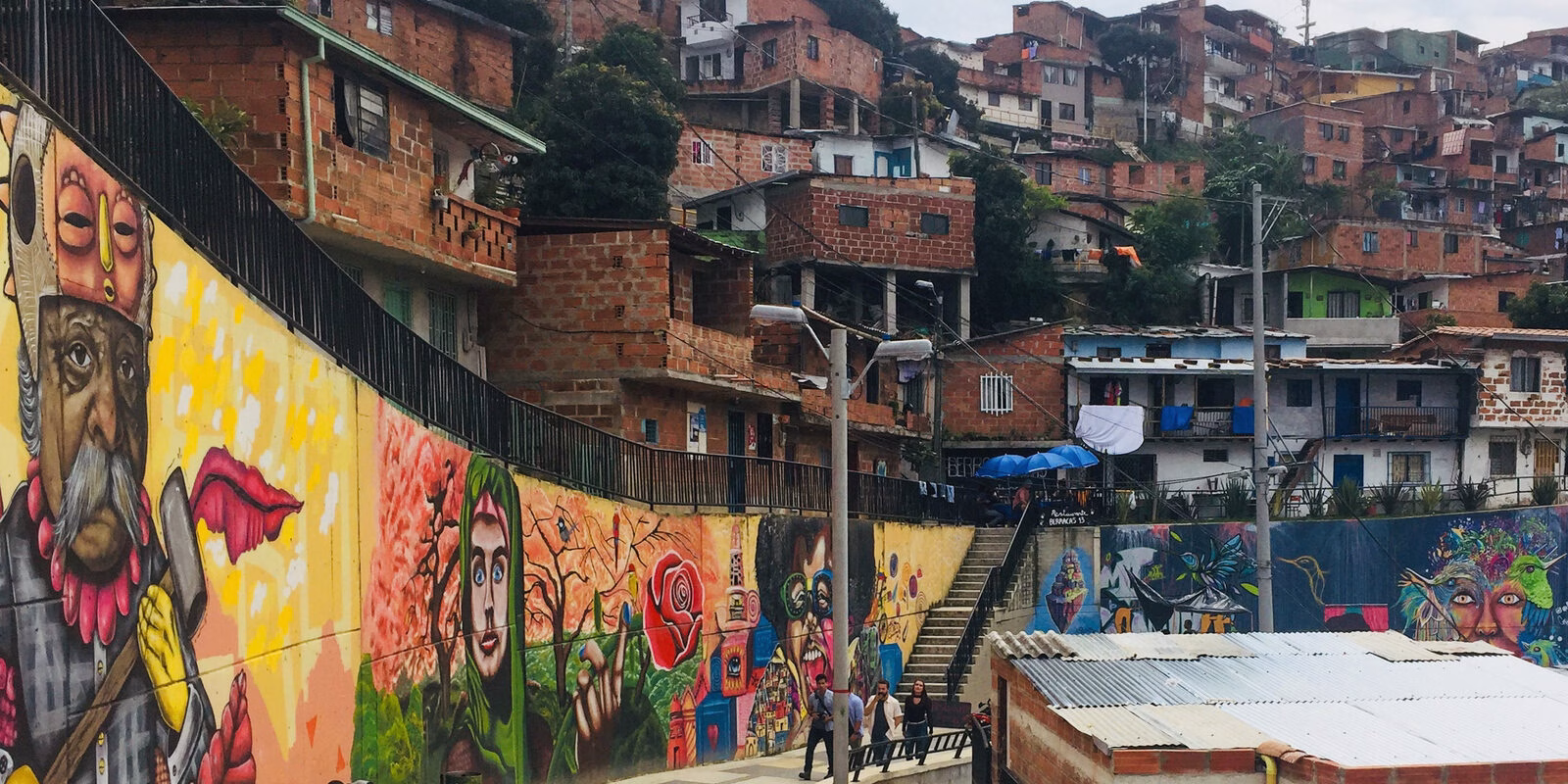 Murals and hillside homes seen on a Graffiti Tour Medellín in Comuna 13, Medellín, Colombia