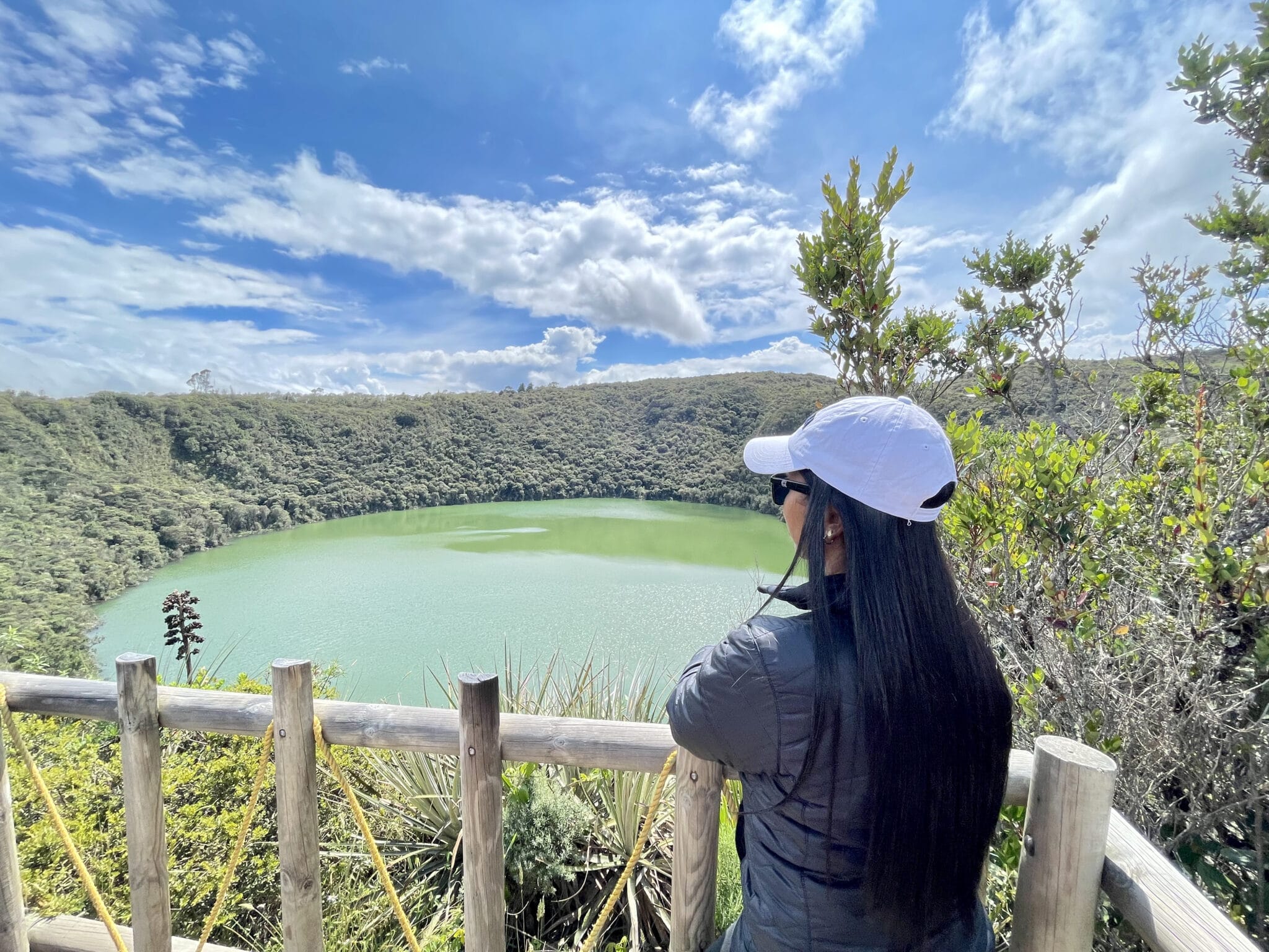 Woman enjoying the Lake Guatavita viewpoint during a Guatavita day trip in Colombia.