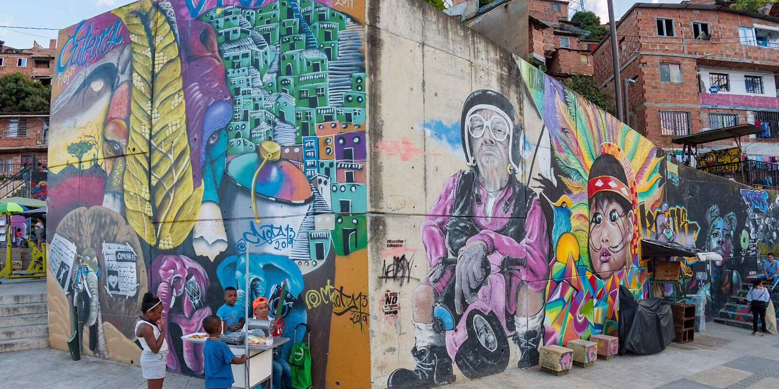 Colorful mural corner and local life on a Graffiti Tour Medellín in Comuna 13, Medellín, Colombia