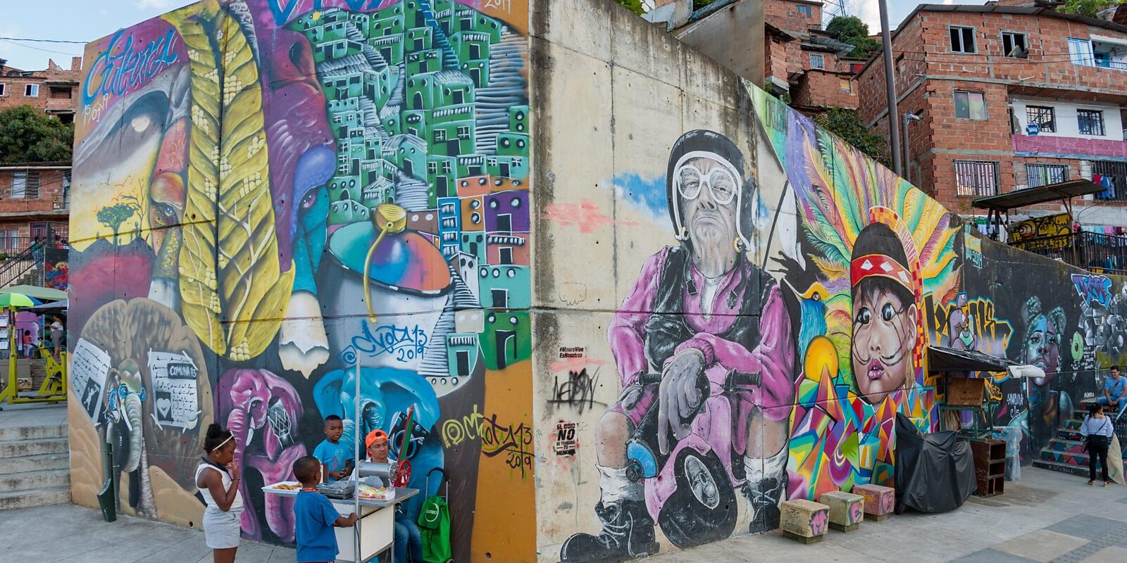Colorful mural corner and local life on a Graffiti Tour Medellin in Comuna 13, Medellin, Colombia