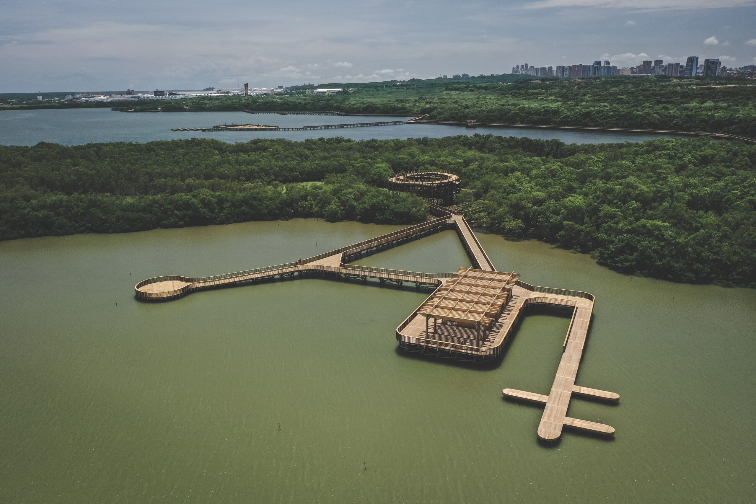 Aerial view of wooden walkways and observation platforms crossing the lagoon at Mallorquin Eco-Park near Barranquilla.