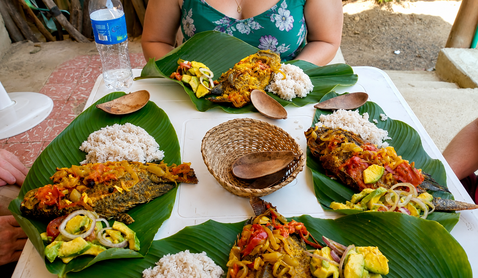 Traditional fish lunch served on banana leaves as part of a San Basilio de Palenque tour.