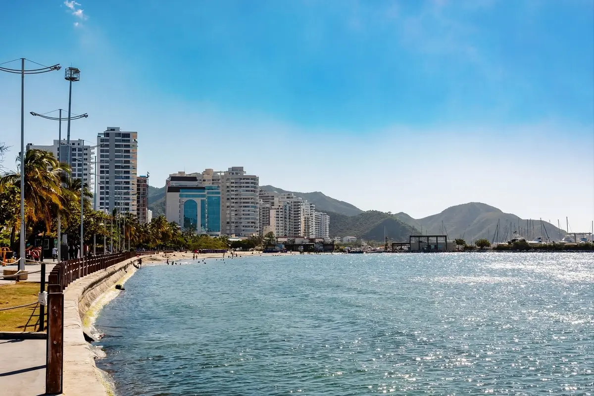 Waterfront view of Santa Marta’s modern skyline and marina on a sunny Santa Marta City Tour.