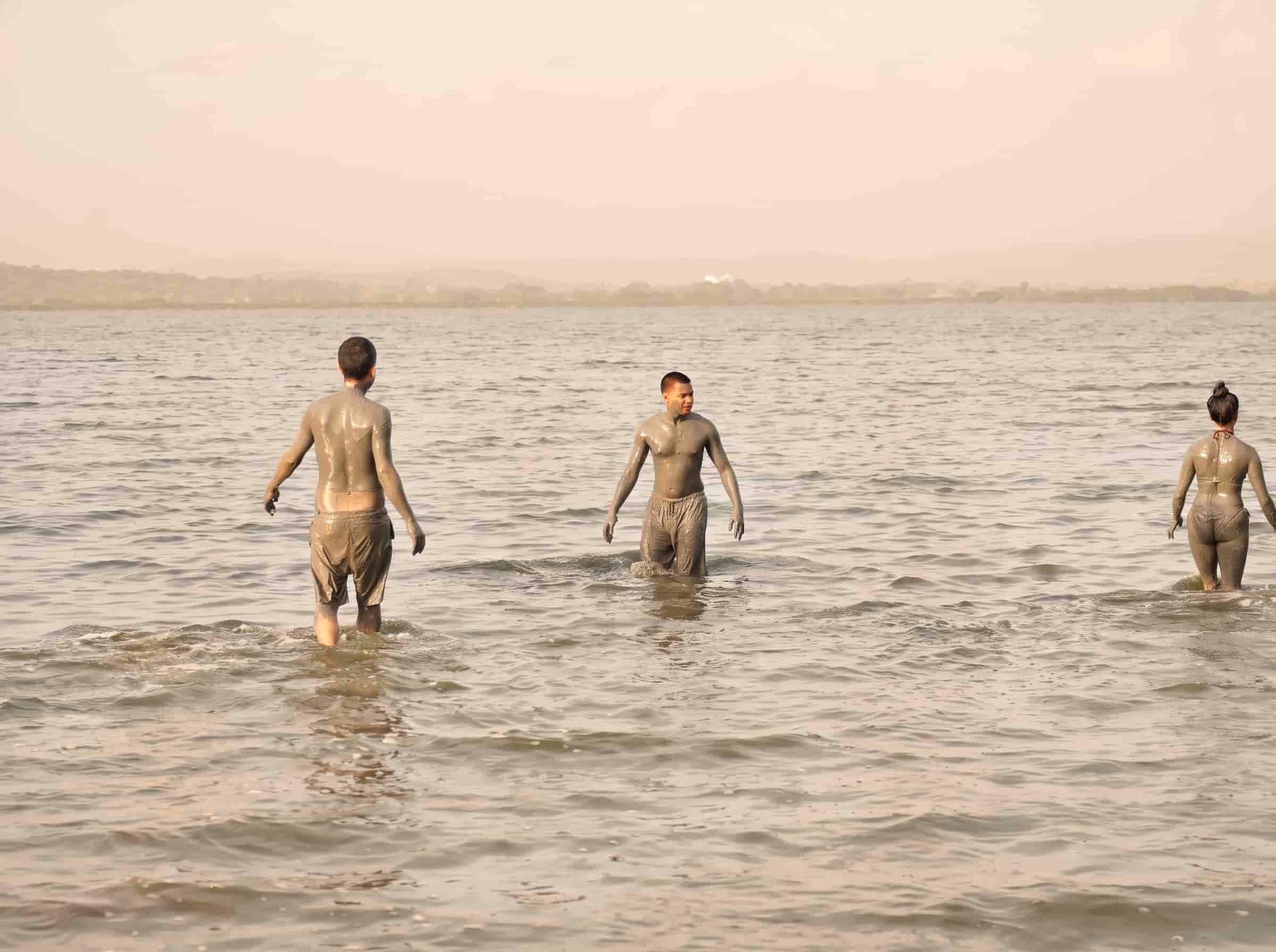 tourists washing off mud in near totumo volcano