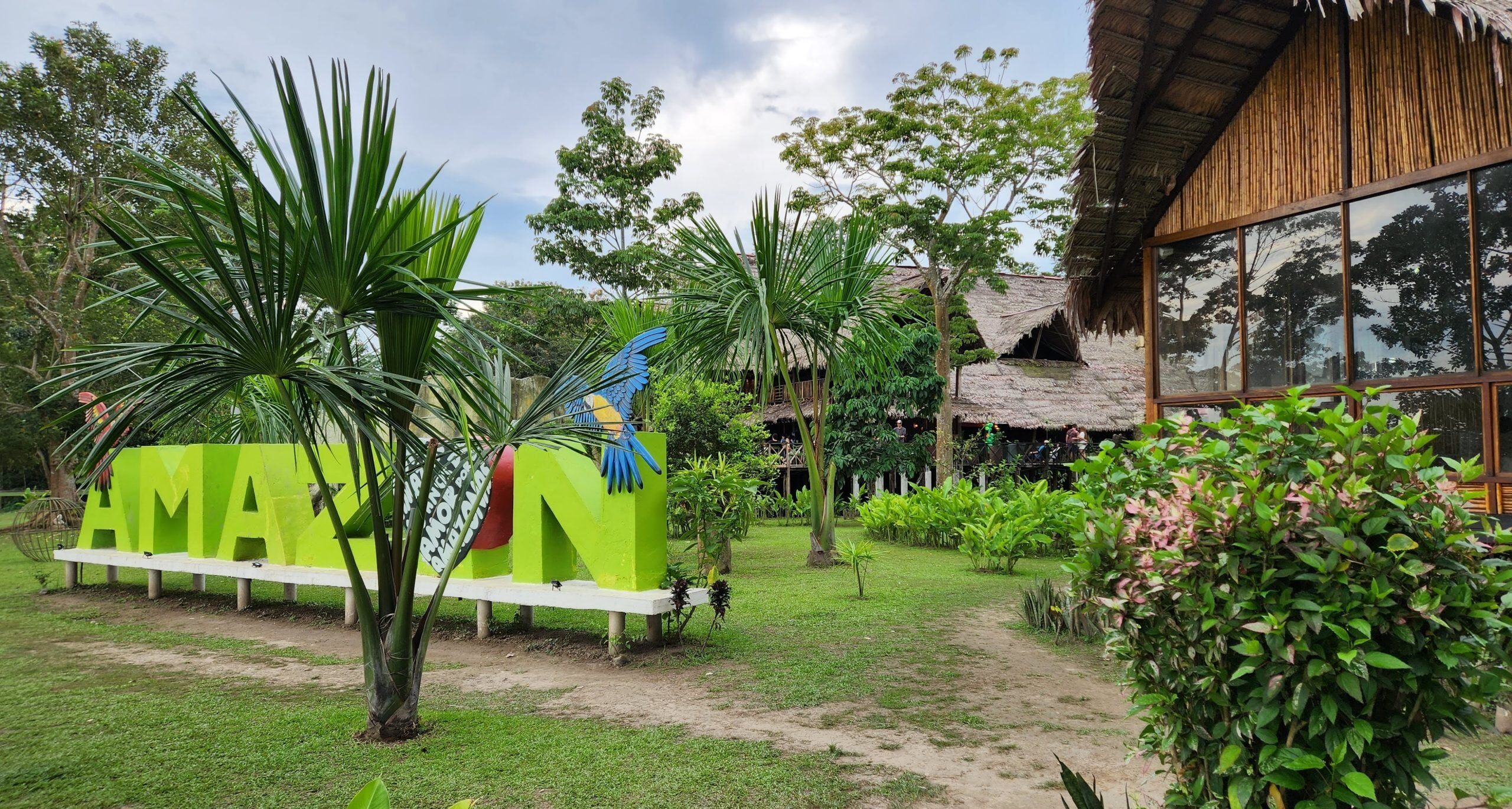 Amazon lodge entrance and tropical gardens featured on an Amazon Three Borders Tour Colombia.