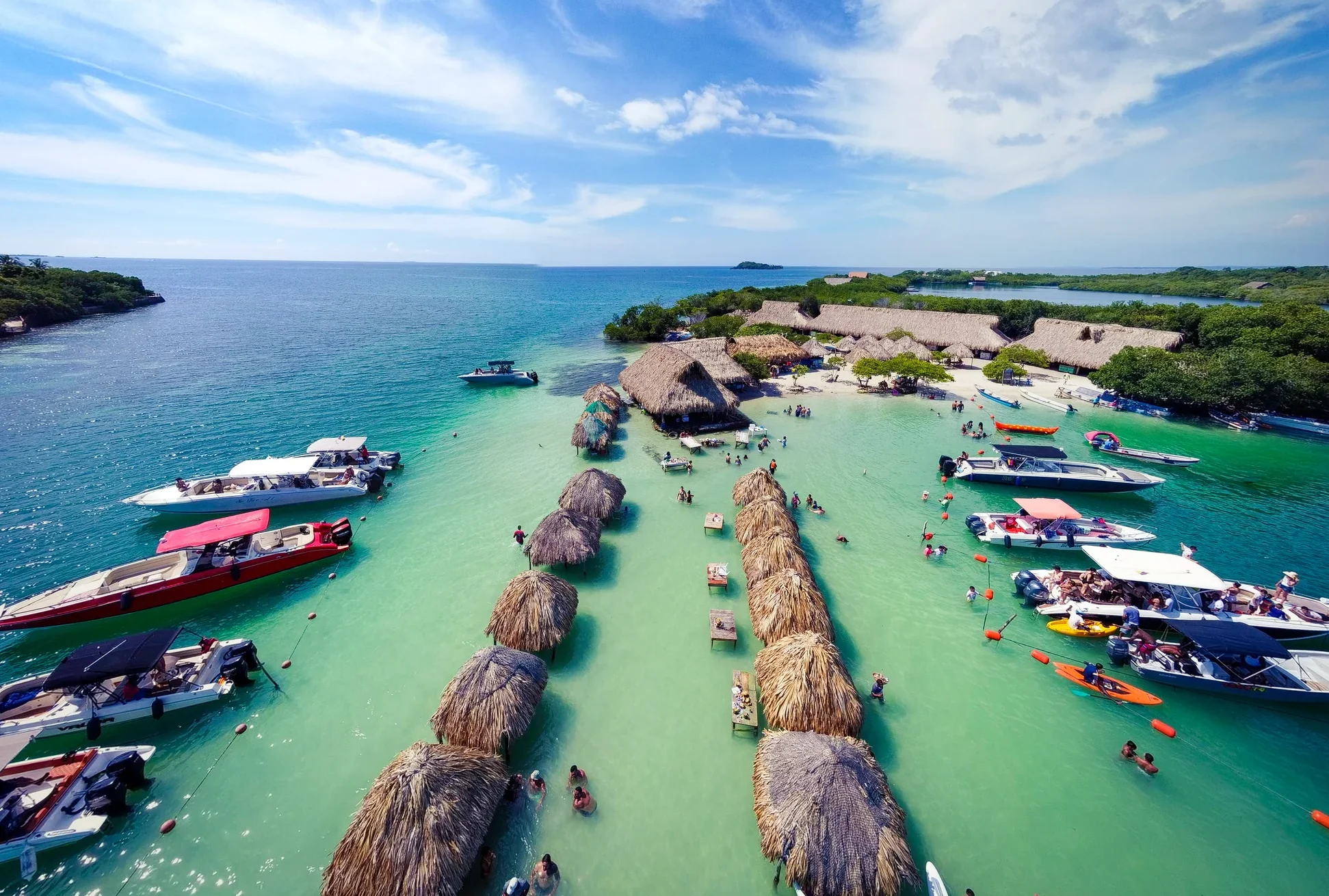 Aerial view of beach huts and boats during a Rosario Islands Tour in Cartagena, Colombia