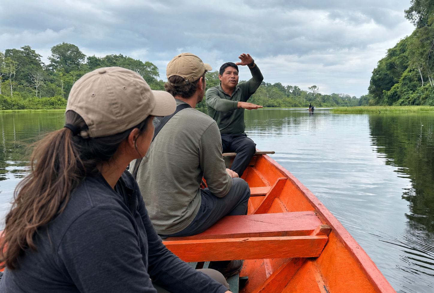 Travelers riding in a canoe while a local guide explains the river landscape on a City tour Leticia Tabatinga.