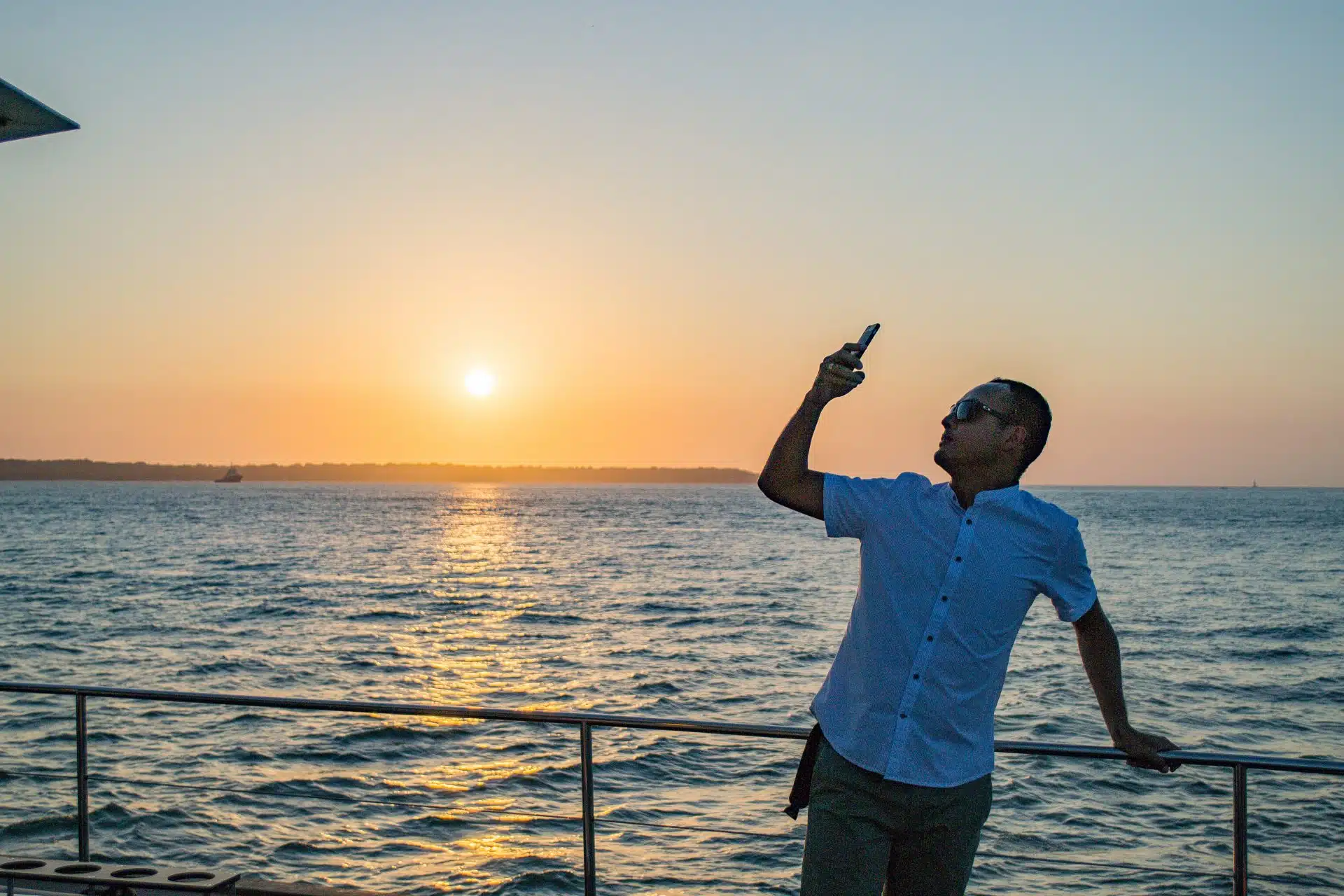 Traveler taking a sunset selfie on board during a cartagena sunset boat tour private in Cartagena.
