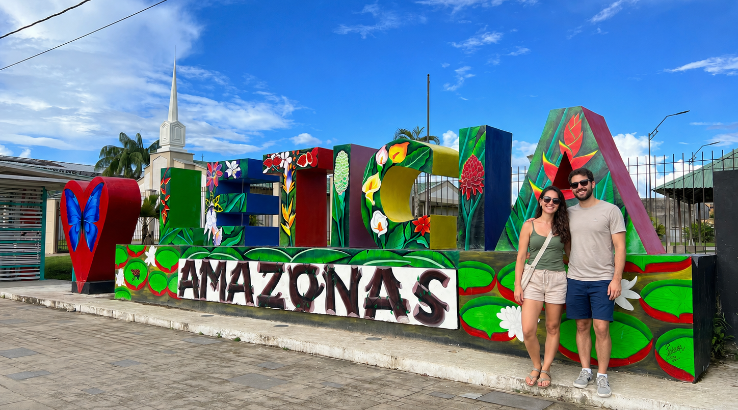 Couple posing beside the colorful Leticia Amazonas sign during a City tour Leticia Tabatinga.