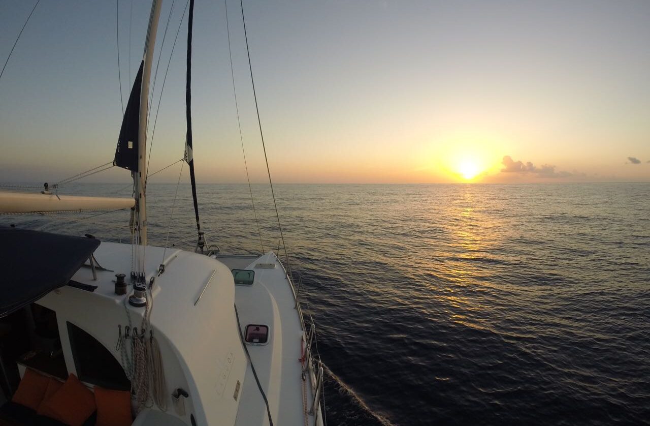 Catamaran sailing across calm waters at sunset during a cartagena sunset boat tour private in Cartagena.
