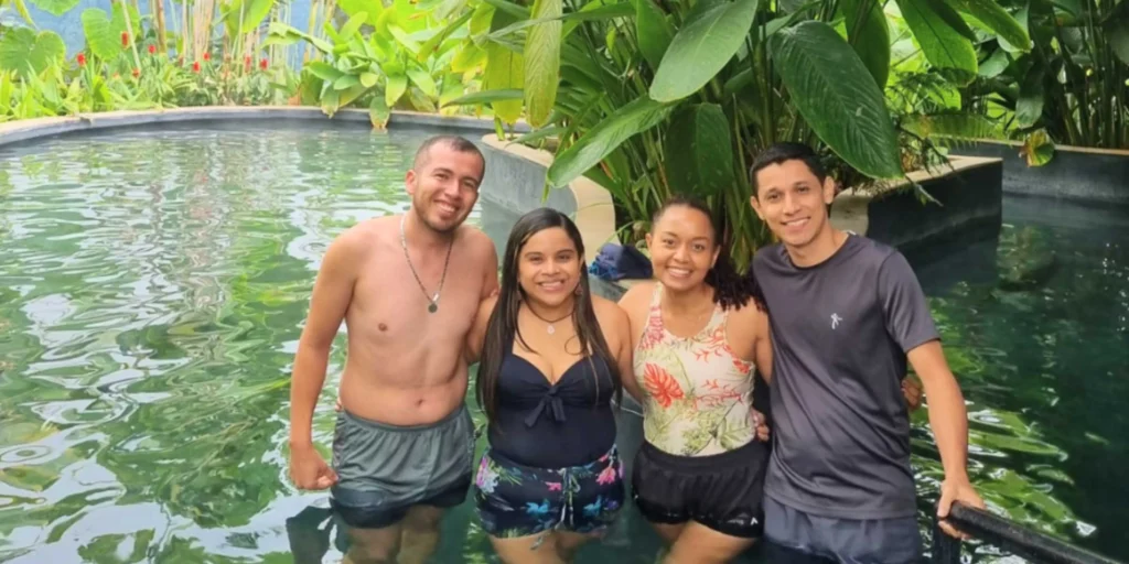 Travelers relaxing in a thermal pool at the Otoño hot springs near Manizales