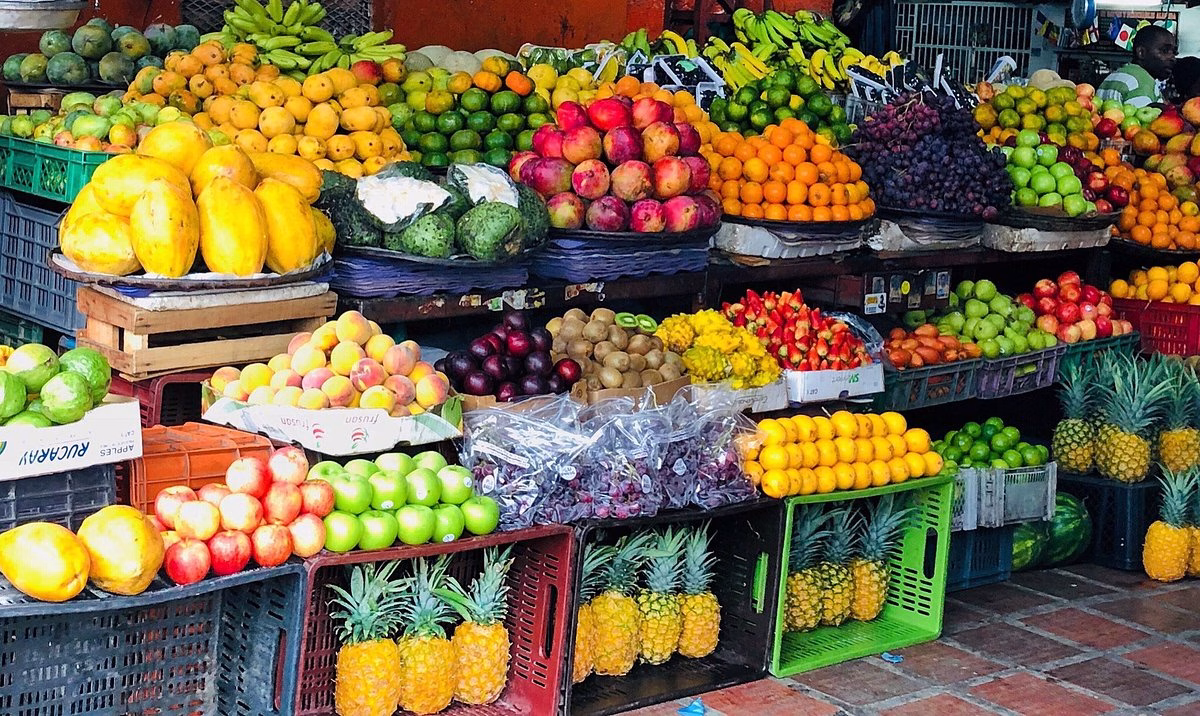 Colorful display of tropical fruits and local ingredients at a market stop during a Food Tour Cali.