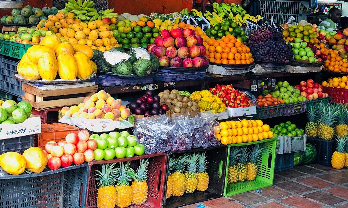 Colorful display of tropical fruits and local ingredients at a market stop during a Food Tour Cali.